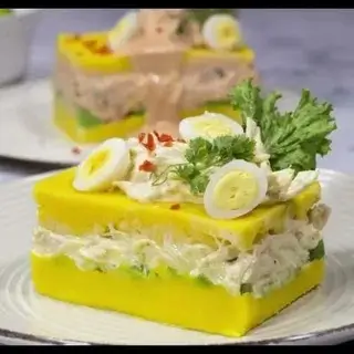 Chicken-stuffed causa dish.
